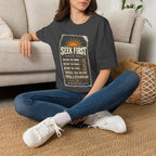 Woman wearing a dark heather Seek First Morning Order Christian T-shirt