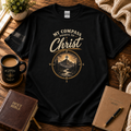 My Compass Points to Christ Christian T-shirt hero image in black with Bible and devotional