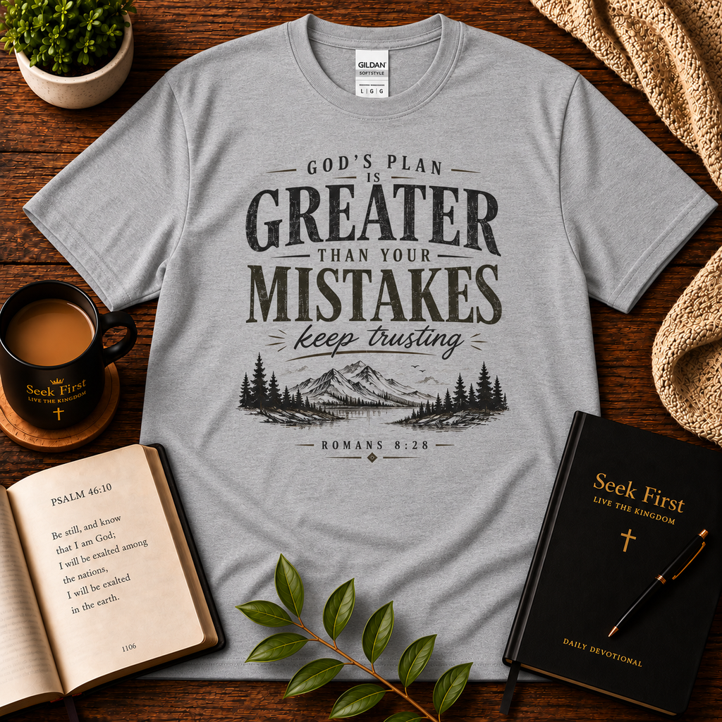 Sport Grey God’s Plan Is Greater Than Your Mistakes Christian T-Shirt displayed with Bible, devotional, mug, and greenery