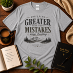 Sport Grey God’s Plan Is Greater Than Your Mistakes Christian T-Shirt displayed with Bible, devotional, mug, and greenery